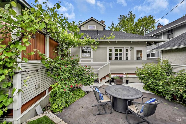 1707 W Resseguie St, Boise, ID 83702 - view of patio / terrace with entry steps and a fire pit