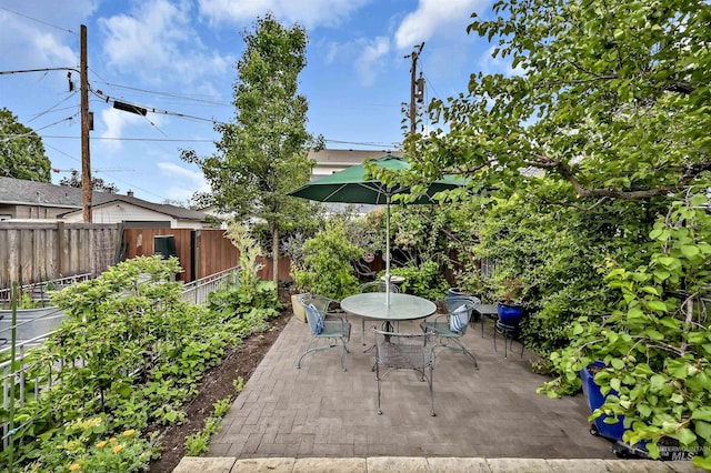 1707 W Resseguie St, Boise, ID 83702 - fenced backyard with a patio and outdoor dining area