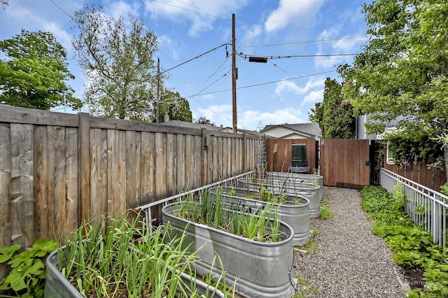 1707 W Resseguie St, Boise, ID 83702 - fenced backyard with a vegetable garden