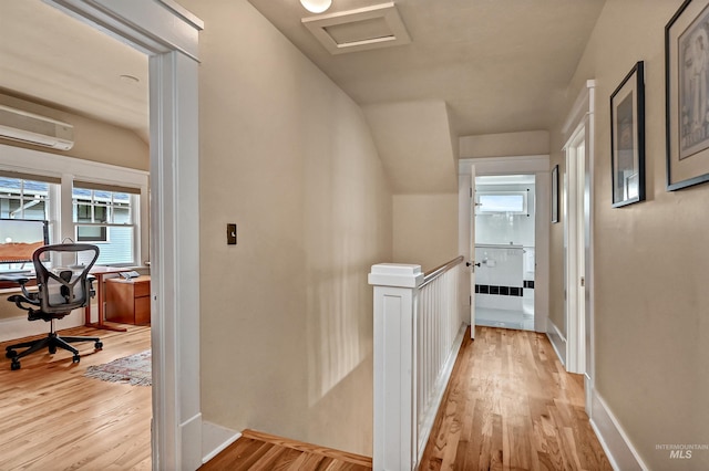 1707 W Resseguie St, Boise, ID 83702 - hallway with an upstairs landing, light wood-type flooring, and a wall unit AC