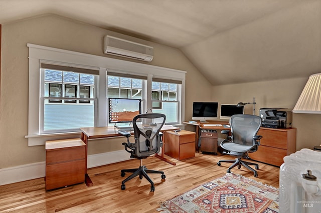 1707 W Resseguie St, Boise, ID 83702 - office area with an AC wall unit, vaulted ceiling, and light wood-style floors