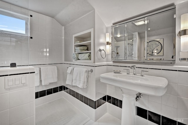 1707 W Resseguie St, Boise, ID 83702 - bathroom with tile walls, a shower stall, lofted ceiling, and built in shelves