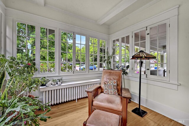 1707 W Resseguie St, Boise, ID 83702 - sunroom / solarium featuring radiator heating unit, beamed ceiling, wood finished floors, and french doors