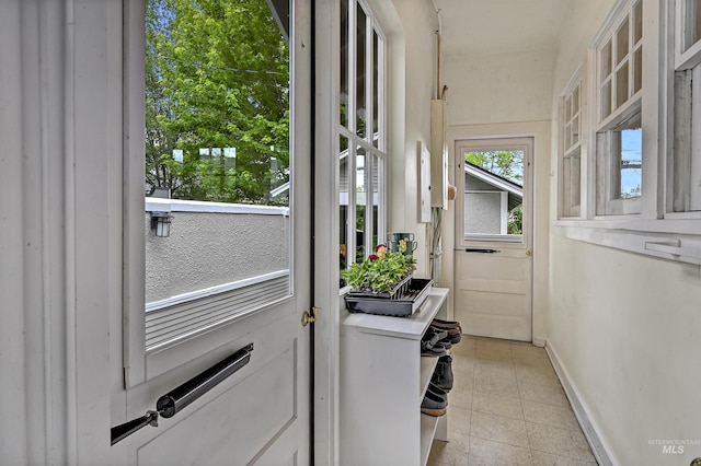 1707 W Resseguie St, Boise, ID 83702 - doorway to outside featuring light tile patterned floors and baseboards