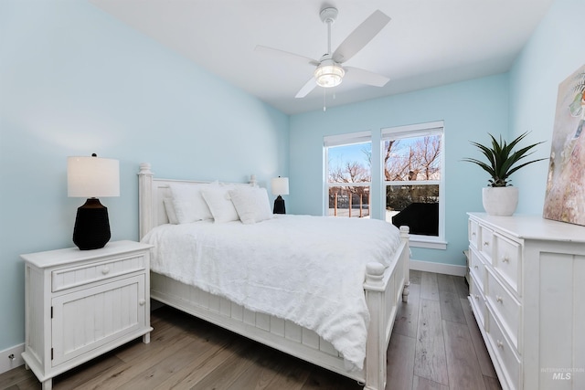 bedroom with hardwood / wood-style flooring and ceiling fan