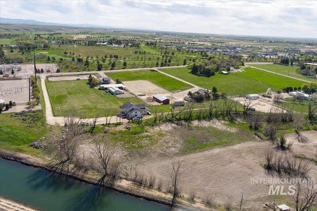 aerial view featuring a rural view and a water view