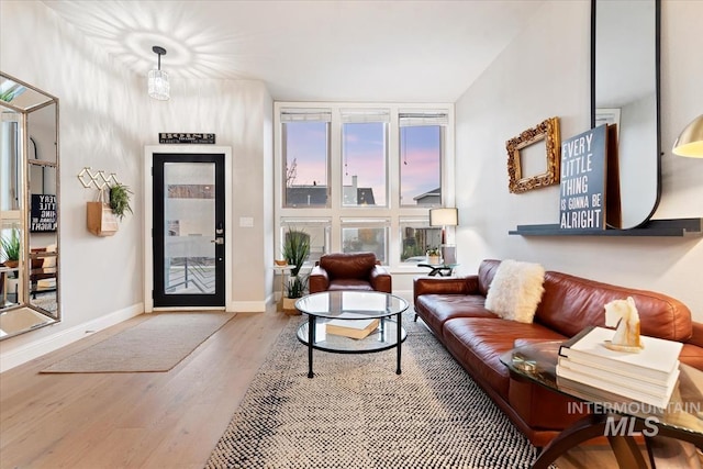 476 E Thurman Mill St, Garden City, ID 83714 - living room featuring wood finished floors and baseboards
