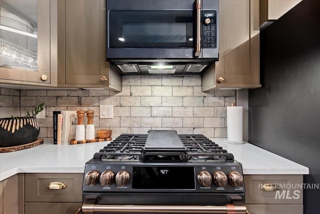 476 E Thurman Mill St, Garden City, ID 83714 - kitchen featuring gray cabinets, stainless steel microwave, range with gas cooktop, and decorative backsplash