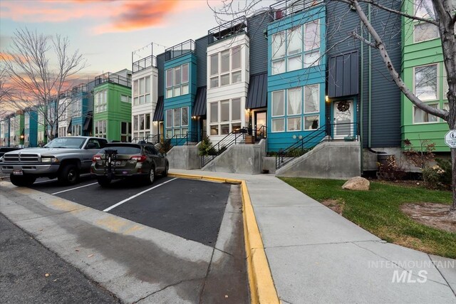 476 E Thurman Mill St, Garden City, ID 83714 - view of building exterior with a residential view and uncovered parking