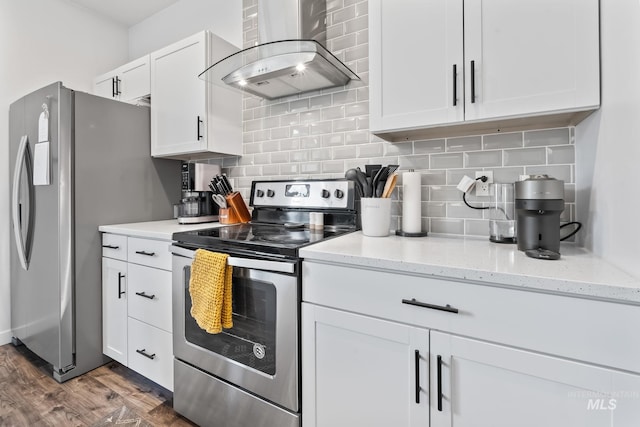 2114 W Claira Rd, Nampa, ID 83651 - kitchen with backsplash, wall chimney range hood, appliances with stainless steel finishes, and white cabinetry