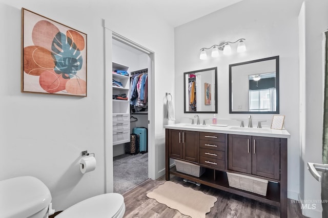 2114 W Claira Rd, Nampa, ID 83651 - full bath featuring toilet, a sink, and wood finished floors