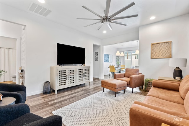 2114 W Claira Rd, Nampa, ID 83651 - living room featuring wood finished floors, a ceiling fan, visible vents, and recessed lighting