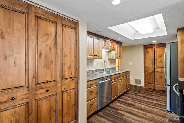 773 Monroe St, Twin Falls, ID 83301 - kitchen with stainless steel appliances, a sink, brown cabinets, dark wood-style floors, and recessed lighting