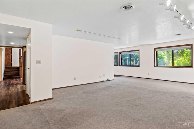 773 Monroe St, Twin Falls, ID 83301 - unfurnished room with carpet flooring, stairs, baseboards, and track lighting