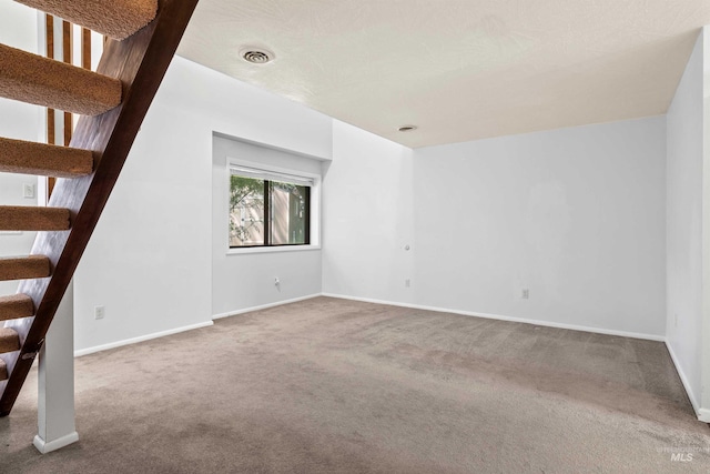 773 Monroe St, Twin Falls, ID 83301 - unfurnished living room with carpet floors, stairway, and baseboards