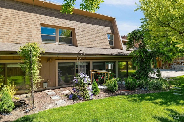 773 Monroe St, Twin Falls, ID 83301 - back of house with a shingled roof, a lawn, and a patio area