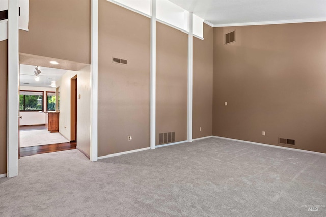 773 Monroe St, Twin Falls, ID 83301 - carpeted empty room with ornamental molding, baseboards, and vaulted ceiling