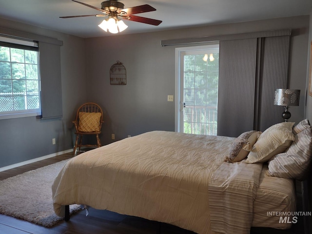 bedroom featuring hardwood / wood-style floors, access to outside, and ceiling fan