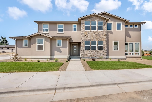 view of front of home featuring a front yard