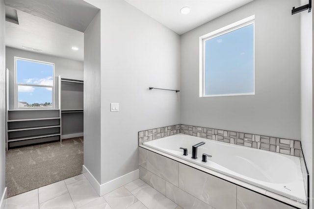 bathroom with tiled bath