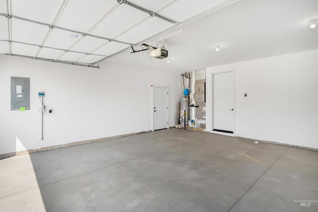 garage featuring electric panel and a garage door opener