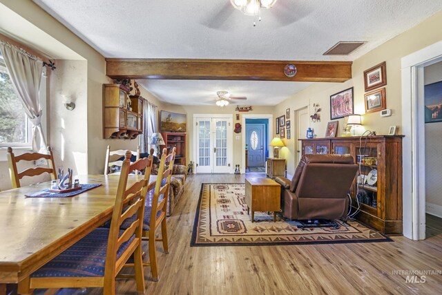 3242 S 2000 E, Wendell, ID 83355 - living room with visible vents, ceiling fan, beamed ceiling, french doors, and wood finished floors