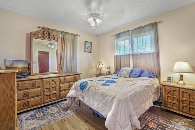 3242 S 2000 E, Wendell, ID 83355 - bedroom featuring a textured ceiling and wood finished floors