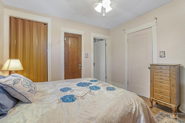 3242 S 2000 E, Wendell, ID 83355 - bedroom with a ceiling fan and wood finished floors