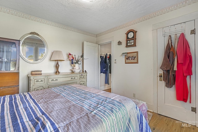 3242 S 2000 E, Wendell, ID 83355 - bedroom featuring a textured ceiling and wood finished floors