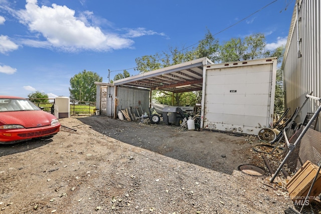 3242 S 2000 E, Wendell, ID 83355 - garage featuring a carport and fence
