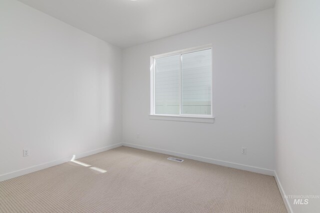 8900 W Snow Wolf Dr, Star, ID 83669 - unfurnished room featuring light colored carpet and baseboards