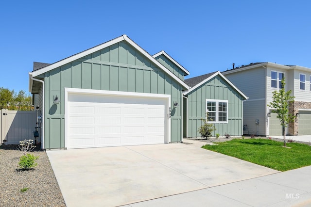 8900 W Snow Wolf Dr, Star, ID 83669 - view of front of property featuring board and batten siding, concrete driveway, and a garage