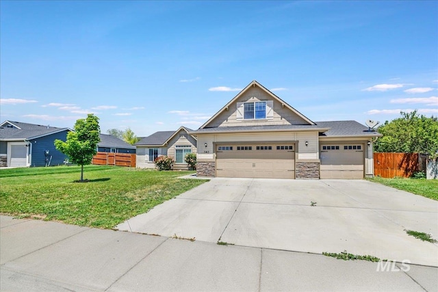 740 SW Portal St, Mountain Home, ID 83647 - craftsman-style house featuring driveway, stone siding, and a garage