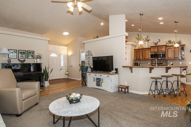 15697 Cupid Dr, Caldwell, ID 83607 - living room with ceiling fan and lofted ceiling