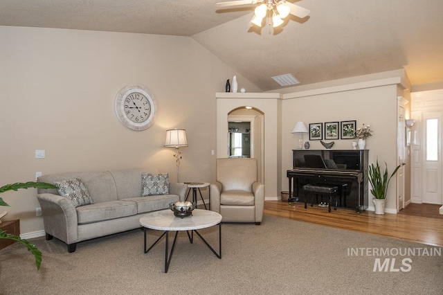 15697 Cupid Dr, Caldwell, ID 83607 - living room with carpet, ceiling fan, and lofted ceiling