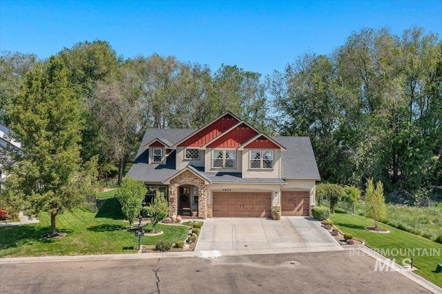 1404 Sandal Crk, Nampa, ID 83686 - craftsman-style house with driveway, an attached garage, stone siding, and a front yard