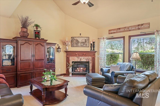 1404 Sandal Crk, Nampa, ID 83686 - living room with a ceiling fan, a premium fireplace, light carpet, and high vaulted ceiling