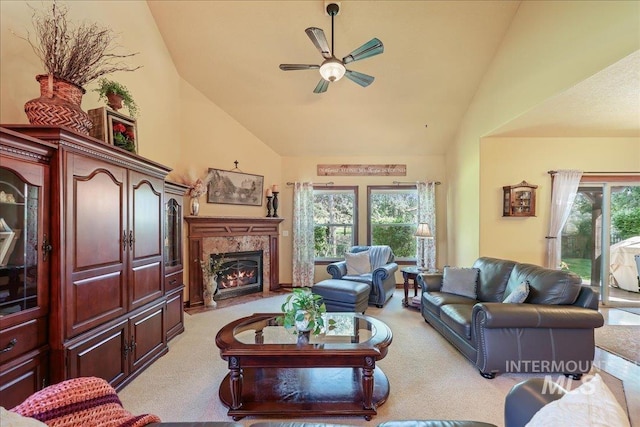 1404 Sandal Crk, Nampa, ID 83686 - living room with high vaulted ceiling, light colored carpet, ceiling fan, and a high end fireplace