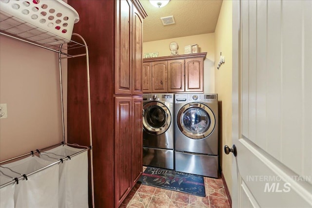 1404 Sandal Crk, Nampa, ID 83686 - laundry area with cabinet space, separate washer and dryer, and a textured ceiling