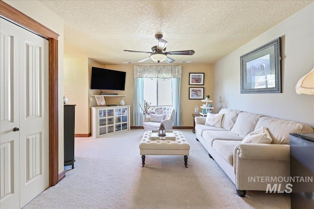 1404 Sandal Crk, Nampa, ID 83686 - carpeted living room featuring ceiling fan, a textured ceiling, and baseboards