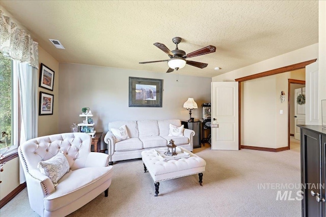 1404 Sandal Crk, Nampa, ID 83686 - living room with ceiling fan, light colored carpet, baseboards, and a textured ceiling