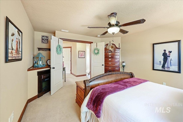 1404 Sandal Crk, Nampa, ID 83686 - bedroom with light carpet, baseboards, a textured ceiling, and ceiling fan