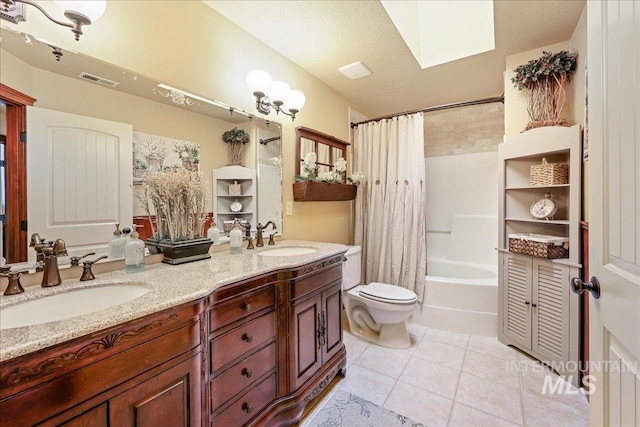 1404 Sandal Crk, Nampa, ID 83686 - full bath featuring tile patterned floors, double vanity, shower / tub combo with curtain, toilet, and a skylight
