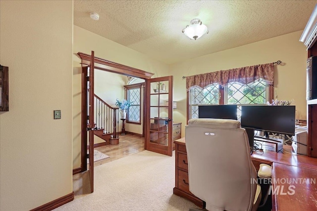 1404 Sandal Crk, Nampa, ID 83686 - office area featuring french doors, light carpet, a textured ceiling, and baseboards
