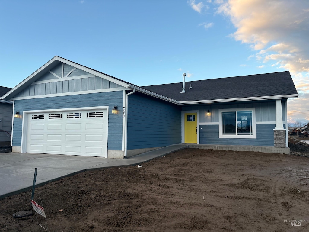 ranch-style home featuring a garage