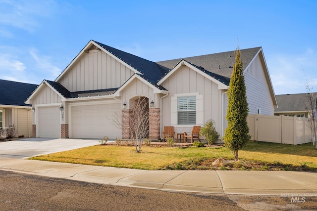 view of front of house with a front lawn and a garage