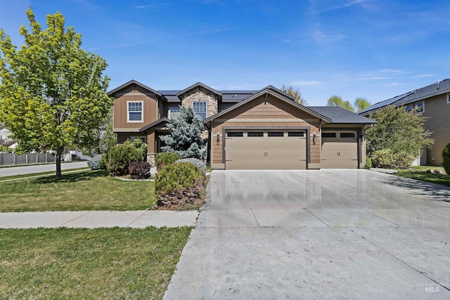 1242 E Tuttle St, Meridian, ID 83646 - craftsman-style house with driveway, a front yard, a garage, roof mounted solar panels, and stone siding