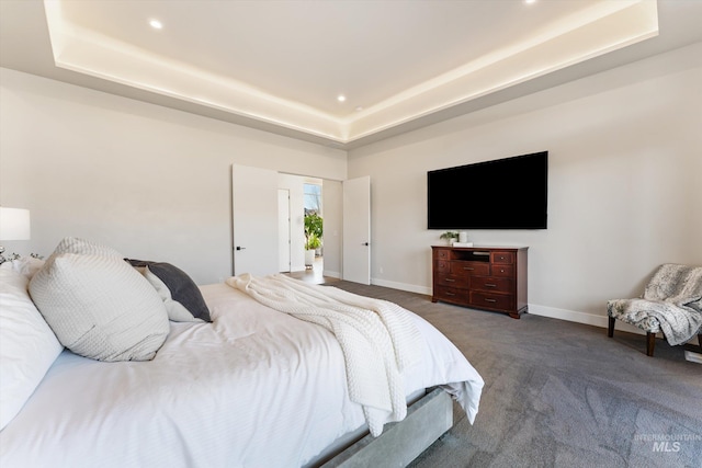 bedroom featuring a raised ceiling