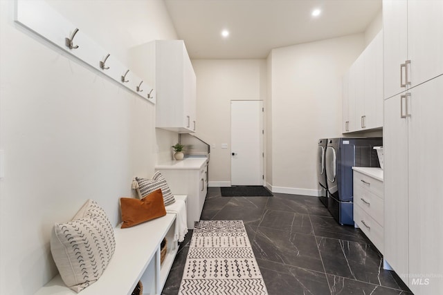 laundry room with cabinets and independent washer and dryer