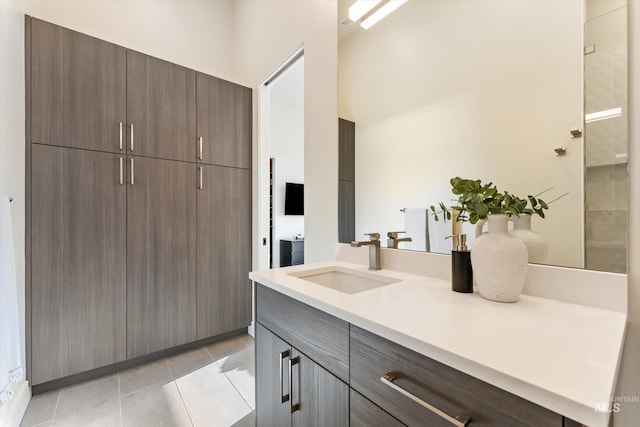 bathroom with vanity and tile patterned flooring